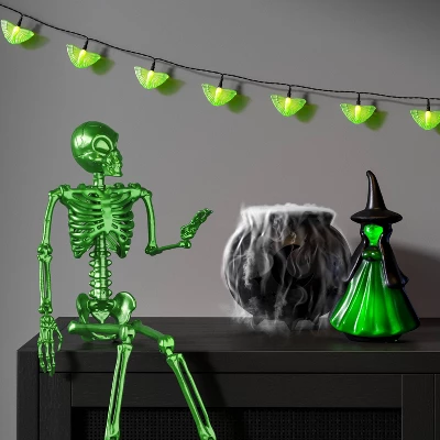 24" Poseable Alien Skeleton Halloween Decorative Prop Ghoulish Glow Green - Hyde And EEK! Boutique™ 1 24" Poseable Alien Skeleton Halloween Decorative Prop Ghoulish Glow Green - Hyde And EEK! Boutique™